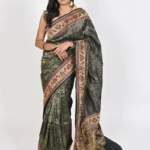 Embrace timeless beauty with our black Katan silk saree, featuring intricate all over zari work, a stunning designer meenakari border, and a magnificent pallu. Perfect for formal events or special occasions