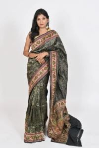 Embrace timeless beauty with our black Katan silk saree, featuring intricate all over zari work, a stunning designer meenakari border, and a magnificent pallu. Perfect for formal events or special occasions.